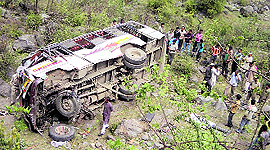 The ill-fated bus on the riverbed after the accident.