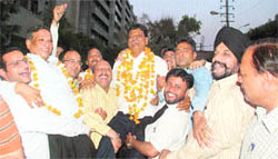 Ashok Mittal (lifted) who was elected president of the District Bar Association with his supporters in a jubilant mood in Ludhiana 