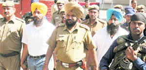 Jagtar Singh Hawara (left) and Paramjit Singh Bheora being taken to court in Chandigarh on Saturday.