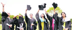 Students of College of Engineering of Roorkee flash their convocation hats after getting degrees in Roorkee on Saturday. 