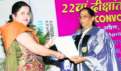 Dr Sudha Rani Pandey, Vice-Chancellor, Uttarakhand Sanskrit University, presents a degree to a student in Dehradun on Saturday.