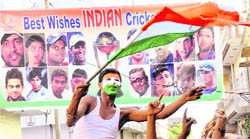 A cricket fan cheers the Indian team during its Cricket World Cup final with Sri Lanka in Mumbai, at Sadar Bazar in Karnal 