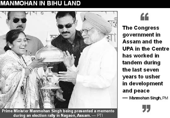 Prime Minister Manmohan Singh being presented a memento during an election rally in Nagaon, Assam