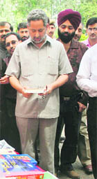 Abdul Gani Malik, Minister for Higher Education, at a book stall during the 22nd IGNOU convocation in Jammu on Saturday