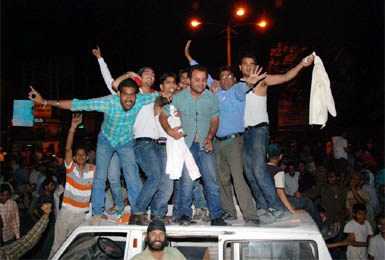 Jubilant cricket lovers climb a four-wheeler to celebrate Indias win over Sri Lanka in the final match of the World Cup-2011, at the Fire Brigade chowk in Bathinda late on Saturday evening. 