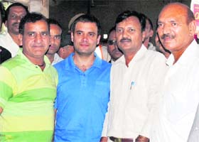 AICC general secretary Rahul Gandhi with his supporters at a dhaba in Karnal