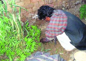 Pala Ram shows the place where he had hidden the mortal remains of a child at his residence in Kalotha village in Fatehabad