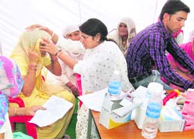 A woman being examined at a medical camp at Baiyanpur village in Sonepat on Sunday