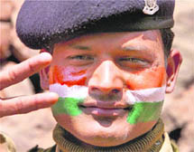 A CRPF jawan with his face painted celebrates Team India's victory in the World Cup final in Srinagar.