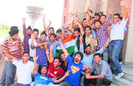 Cricket buffs dance to the tunes of bhangra to mark the occasion at Government College of Engineering and Technology in Jammu on Sunday