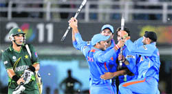 cheers! Indian players celebrate their victory over Pakistan in Mohali. India won by 29 runs in this semifinal clash.