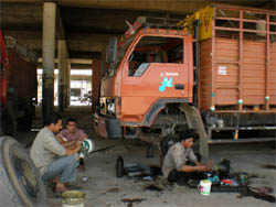 A truck being repaired under the main shed of the grainyard in Bathinda