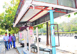 A bus queue shelter without a timetable and a route map at Sector 8, Chandigarh.