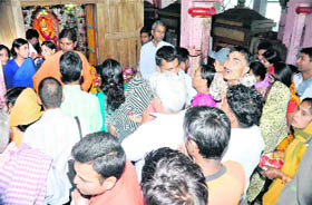 Devotees gather at the Mata Mansa Devi Temple on the first Navratra in Haridwar on Monday