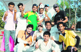 The Doon Defence Academy cricket team with the winners trophy in Dehradun on Monday.