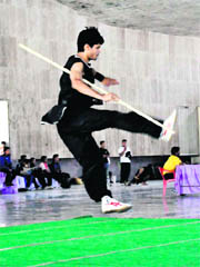 A player showcases his skill at a district-level karate tournament in Roshanabad on Monday