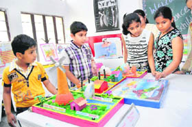 Students learn about the functioning of models during a science exhibition at RS Senior Secondary School in Karnal.