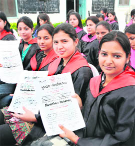 Students proudly show their degrees after the annual convocation of Government Girls College in Karnal.