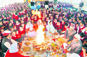 Schoolchildren perform prayers to welcome the new year of the Hindu calendar, Nav Samvatsar 2068, at Sarasvati Vidya Mandir in Shimla on Monday.