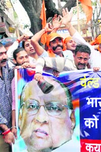 Activists of the Shiv Sena in Jammu on Monday protest against International Cricket Council President Sharad Pawar for allegedly handing over a wrong replica of the Cricket World Cup to Team India