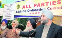 Jagmohan Singh Raina, chairman of the All-Parties Sikh Coordination Committee, (extreme right) addresses mediapersons in Srinagar on Monday