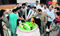DMCH doctors and faculty members cut a cake to celebrate Indias win in the World Cup, in Ludhiana
