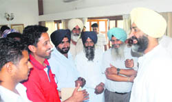 Manpreet Singh Badal, former Punjab Finance Minister and founder of the Peoples Party of Punjab, meets party workers at his residence in Chandigarh
