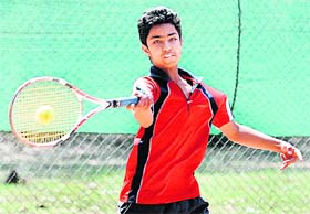 Action Time: A player of the YMCA Total Tennis Academy, Sector 11, returns a shot during the final match of U-14 category in Chandigarh