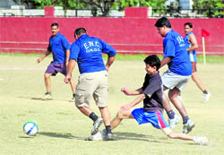Players in action during a match in the ONGC Inter-Departmental Football Tournament in Dehradun on Tuesday. 