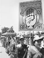 Congress supporters take out a rally ahead of the Assembly elections in Siliguri on Tuesday. 