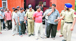 The accused in a gambling case being taken for a medical check-up from the Sector 39 police station in Chandigarh