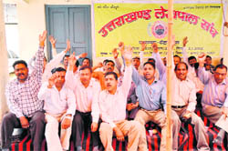 Members of the Uttarakhand Lokpal Sangh protest in Dehradun on Wednesday.