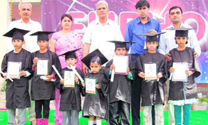 Fatehabad ADC Ashok Kumar Meena (second from right) with "little graduates" in the annual function of MDAV School at Bhattu Kalan in Fatehabad.