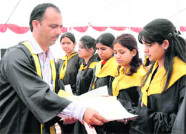 Students receive their degrees during the convocation of Government PG College in Karnal on Thursday. 