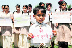 Students of Future Pack Higher Secondary School hold placards in support of Anna Hazare in Jammu on Thursday
