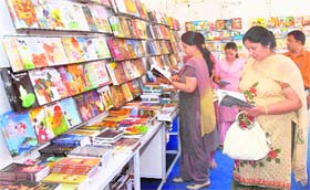 People select books at a book fair in Jalandhar