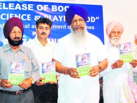 Animal Husbandry Minister Gulzar Singh Ranike releases B.S. Aulakhs book Super Science & Playing God in Amritsar on Friday. 