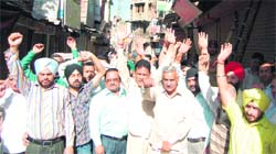 Shopkeepers and residents protest near Jallianwala Bagh in Amritsar.