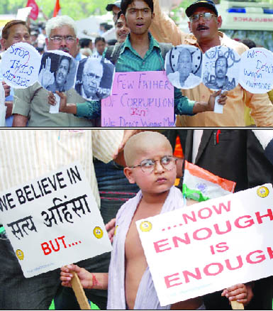 Supporters of Anna Hazare, who is sitting on fast-unto-death against corruption, in New Delhi on Friday.