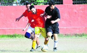 A match in the ONGC Inter-Departmental Football Tournament being played in Dehradun on Friday.
