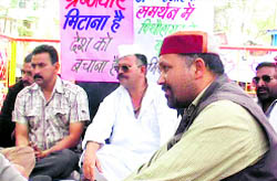People from various walks of life hold a dharna in Pitthoragarh on Friday