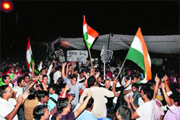 People in a jubilant mood after social activist Anna Hazare reached an agreement with the government on the Lokpal Bill, in New Delhi on Friday
