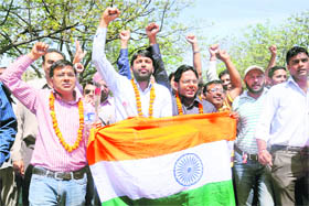 Followers of Gandhian Anna Hazare take out a victory march at the rotary of Sectors 18, 19, 8 and 7 in Chandigarh on Saturday.