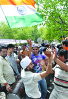 Supporters of Anna Hazare shout victory slogans in New Delhi