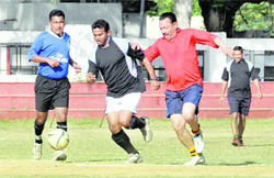 Players vie for the ball at a match of the ONGC Inter-Departmental Football Tournament in Dehradun on Saturday