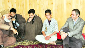 Chief Minister Omar Abdullah condoles the family of slain Jamiat-e-Ahl-e Hadees chief Moulana Showkat Ahmad Shah at his house at Lal Bazaar in Srinagar on Saturday. Showkat Shah was killed in an IED blast on Friday.