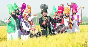 Artistes dressed in traditional attire perform bhangra ahead of Baisakhi in Ludhiana on Saturday.