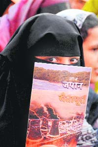 A woman protests at a rally in Ratnagiri