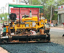 The outer road of Talwandi Sabo gets a fresh coat of premix to make it traffic-worthy before Baisakhi.