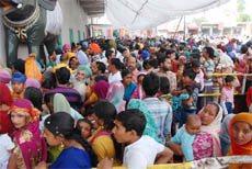 Thousands of devotees moving inside the temple at Maiserkhana to pay obeisance before the Goddess Bhagwati.